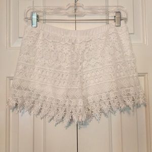 White fringe shorts